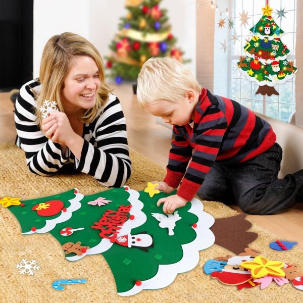 Toddler playing with a safe, interactive felt Christmas tree