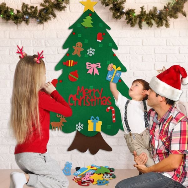 Toddler playing with a safe, interactive felt Christmas tree
