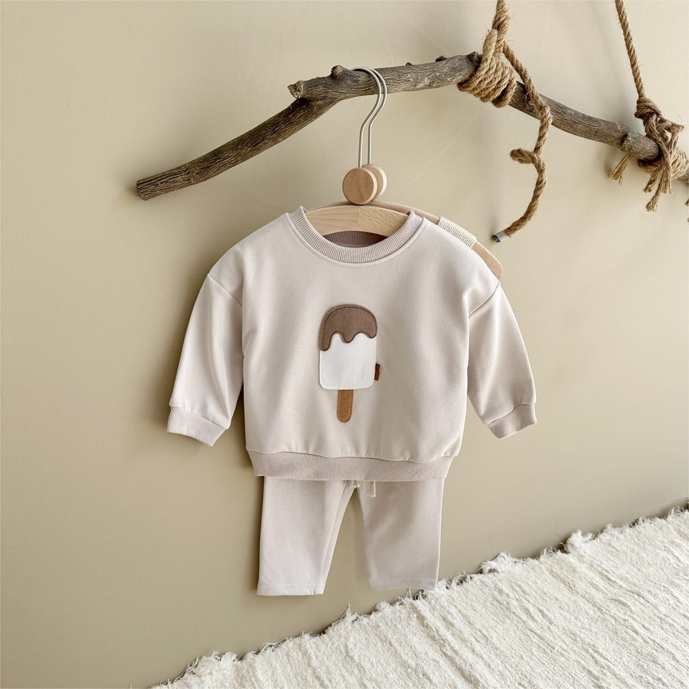 Baby outfit set with a shirt featuring a cute ice cream design and comfy pants, available in various colors for playful and comfortable everyday wear.