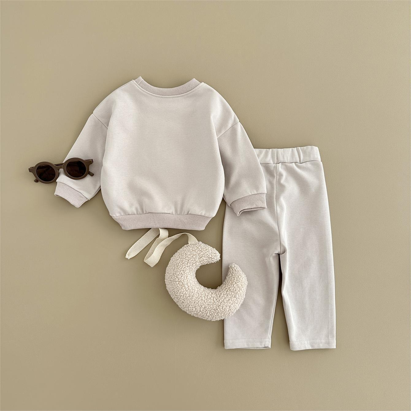 Baby outfit set with a shirt featuring a cute ice cream design and comfy pants, available in various colors for playful and comfortable everyday wear.