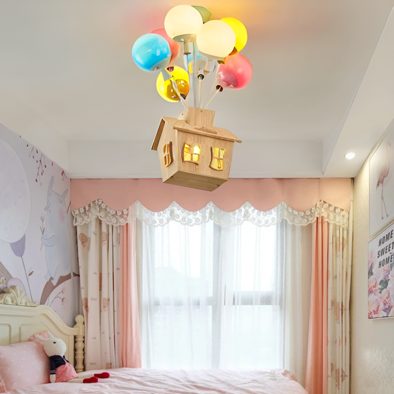 Floating House Lamp - Enchanting Ceiling Light for Kids' Rooms. Features a Charming Wooden House Suspended by Colorful Balloons for a Whimsical Effect. LED Light Source with Energy Efficiency and Long Lifespan. Ideal for Creating a Magical and Cozy Atmosphere. Nordic Modern Design with High-Quality Iron, Wood, and Acrylic Materials. Perfect for Children's Bedrooms and Playrooms.